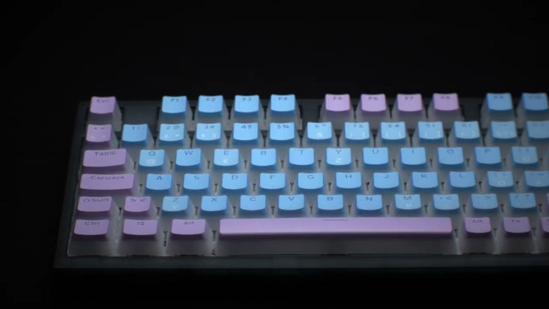 Blue and purple pudding keycaps with black background