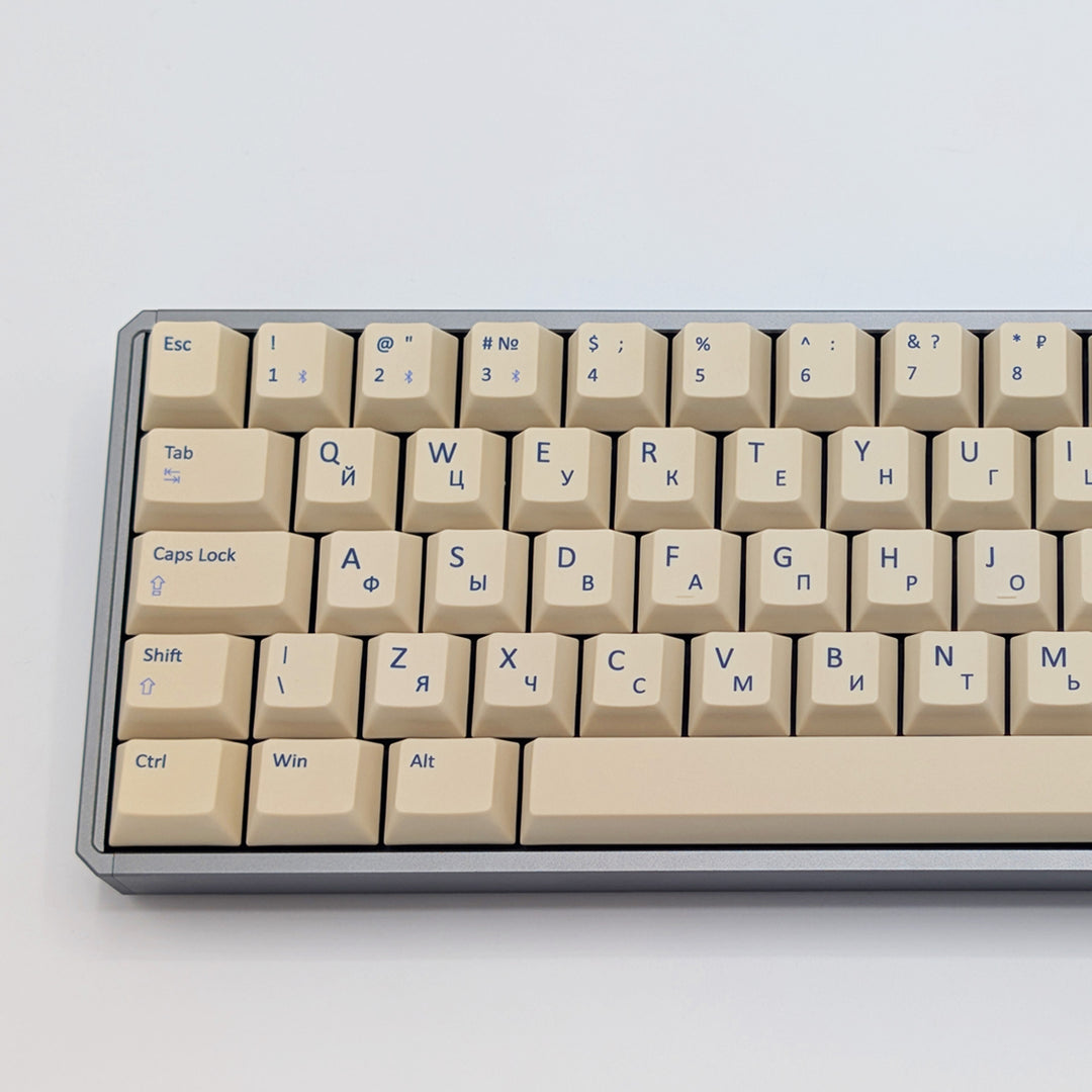Close up of Beige QWERTY &amp; RUSSIAN PBT keycaps on a mechanical keyboard, featuring OEM profile keys with White, Cream, Beige and Off White Keycaps