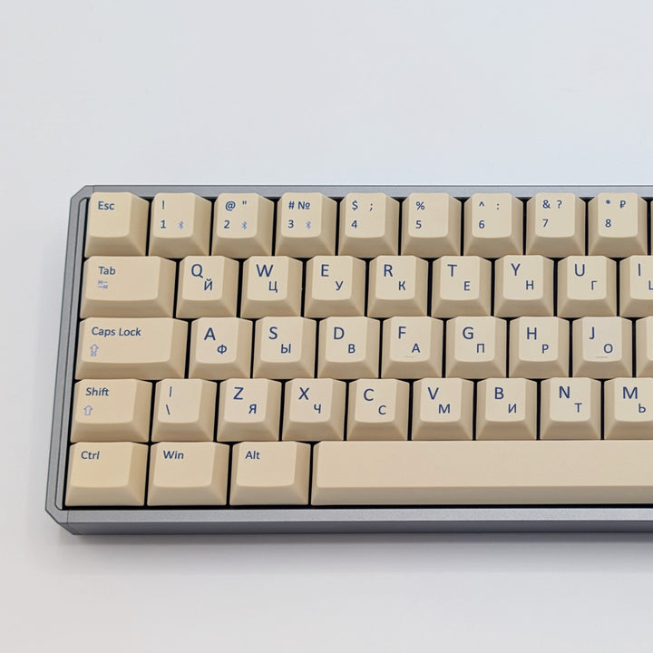 Close up of Beige QWERTY &amp; RUSSIAN PBT keycaps on a mechanical keyboard, featuring OEM profile keys with White, Cream, Beige and Off White Keycaps