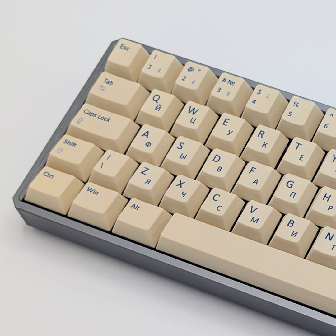 Side shot of Beige QWERTY &amp; RUSSIAN PBT keycaps on a mechanical keyboard, featuring OEM profile keys with White, Cream, Beige and Off White Keycaps