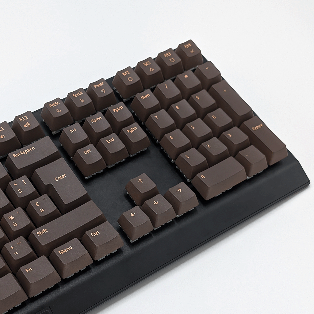 Mechanical keyboard fitted with customisable brown AZERTY PBT keycaps, non-backlit OEM profile with ISO-compatible layout.