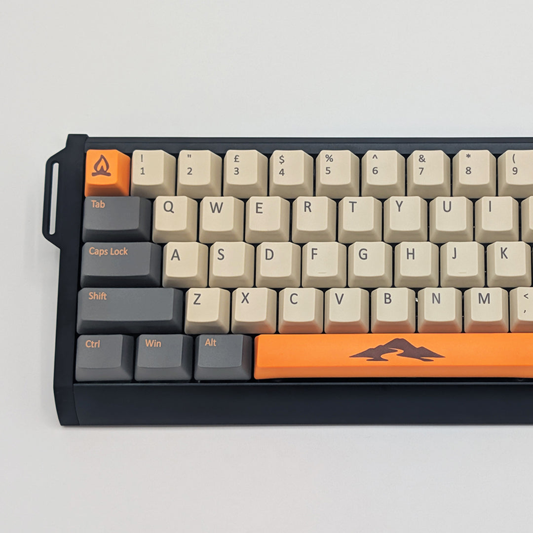 Close-up of CAMPSITE QWERTY PBT keycaps on a mechanical keyboard, featuring OEM profile keys with Off-White/Cream, Grey and Orange Keycaps