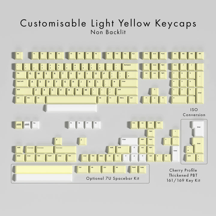 Set of customisable light yellow keycaps on a gray background