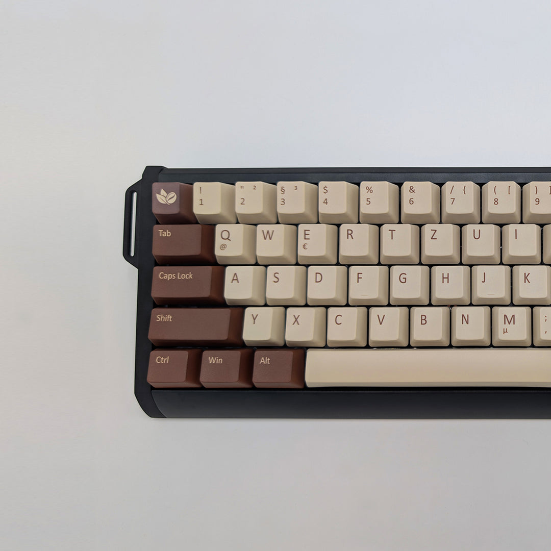 COFFEE QWERTZ PBT keycaps on a mechanical keyboard, featuring OEM profile keys with Off-White/Beige, Brown and Light Brown Keycaps