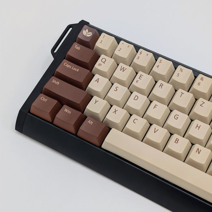 COFFEE QWERTZ PBT keycaps on a mechanical keyboard, featuring OEM profile keys with Off-White/Beige, Brown and Light Brown Keycaps