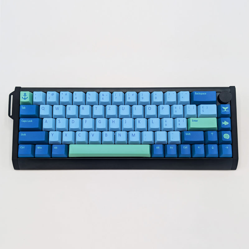 DEEP SEA QWERTZ PBT keycaps on a mechanical keyboard, featuring OEM profile keys with Light Blue, Blue and Mint Green Keycaps