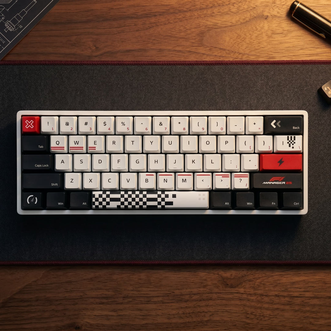 Mechanical keyboard on a wooden desk with a pen and ruler in the background. F1 2022 Manager Branded Keycaps