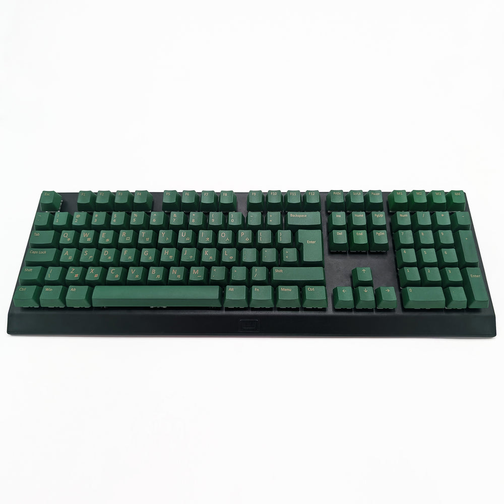 Customisable green non-backlit QWERTY PBT keycaps with gold legends on a mechanical keyboard, featuring OEM profile keys.