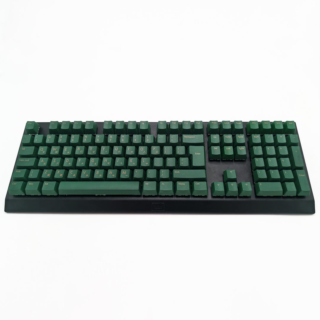 Customisable green non-backlit QWERTY PBT keycaps with gold legends on a mechanical keyboard, featuring OEM profile keys.