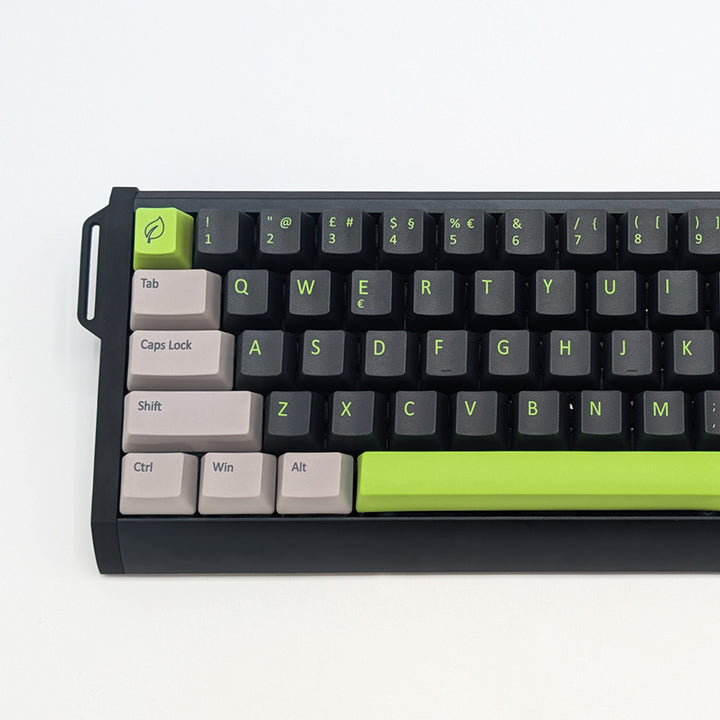 Close-up of GREEN MACHINE QWERTY PBT keycaps on a mechanical keyboard, featuring OEM profile keys with Grey/Black/Charcoal, Grey and Green Keycaps