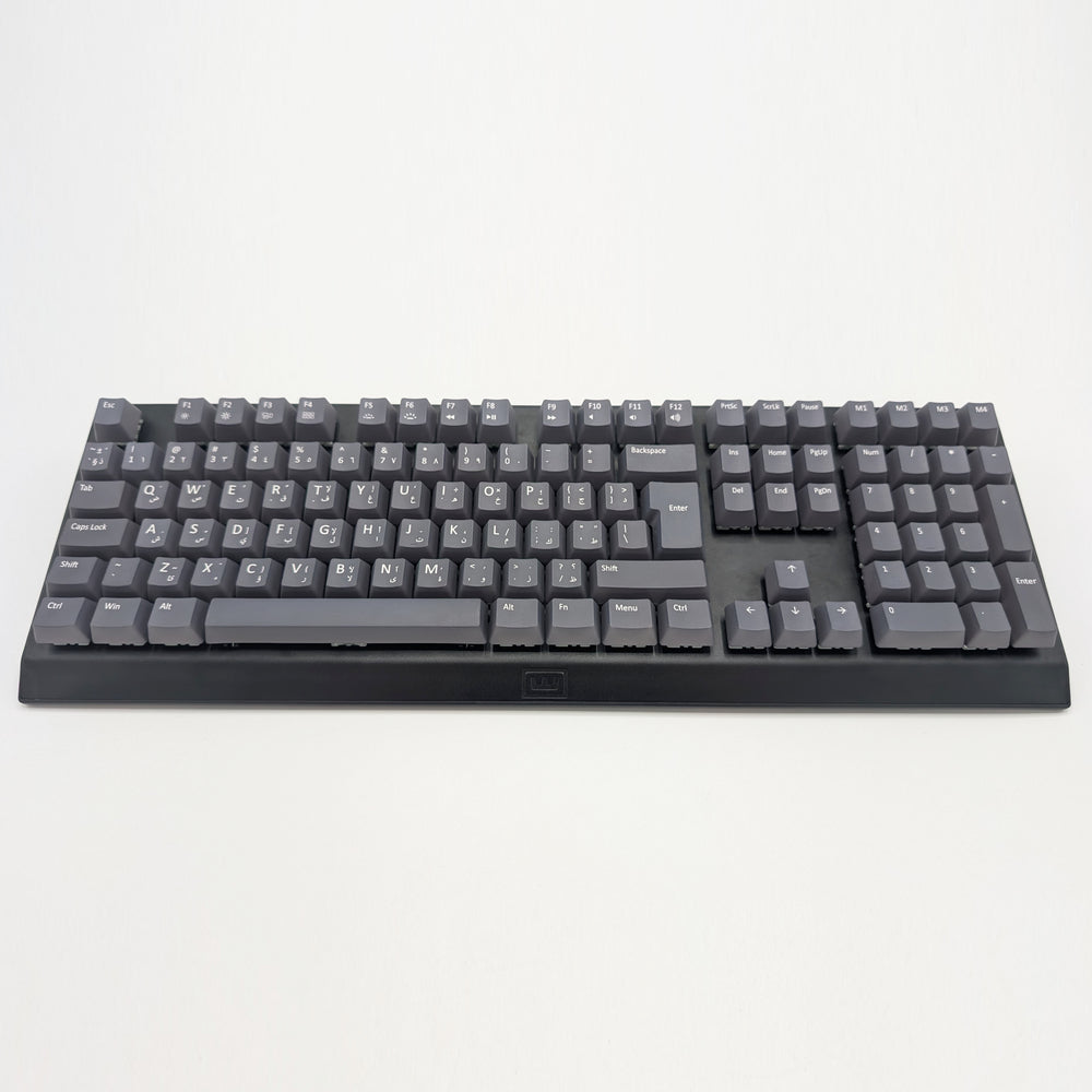 Customisable grey non-backlit QWERTY PBT keycaps with white legends on a mechanical keyboard, featuring OEM profile keys.