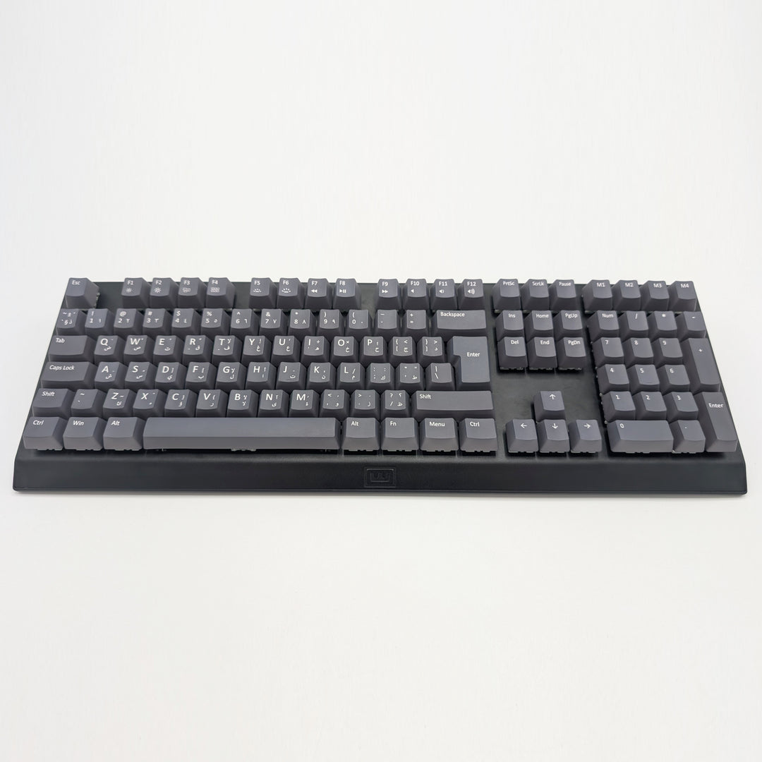 Customisable grey non-backlit QWERTY PBT keycaps with white legends on a mechanical keyboard, featuring OEM profile keys.