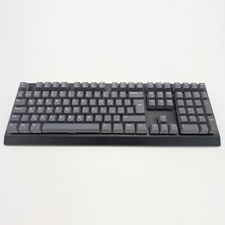 Customisable grey non-backlit QWERTY PBT keycaps with white legends on a mechanical keyboard, featuring OEM profile keys.