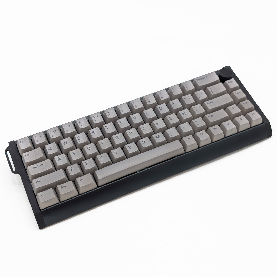 Light grey OEM profile QWERTY PBT keycaps installed on a mechanical keyboard, showing non-backlit keys with dye-sublimated grey legends.