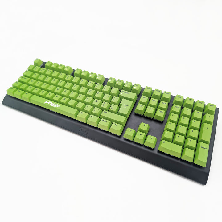 Light green OEM profile AZERTY PBT keycaps installed on a mechanical keyboard, showing non-backlit keys with dye-sublimated black legends.
