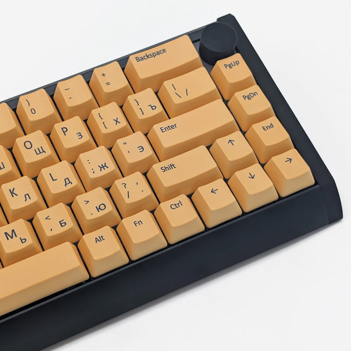 Mechanical keyboard fitted with customisable Light Orange QWERTY PBT keycaps, non-backlit OEM profile with black legends and ANSI-compatible layout.