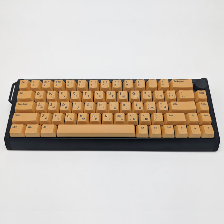 Customisable light orange non-backlit QWERTY PBT keycaps with black legends on a mechanical keyboard, featuring OEM profile keys.