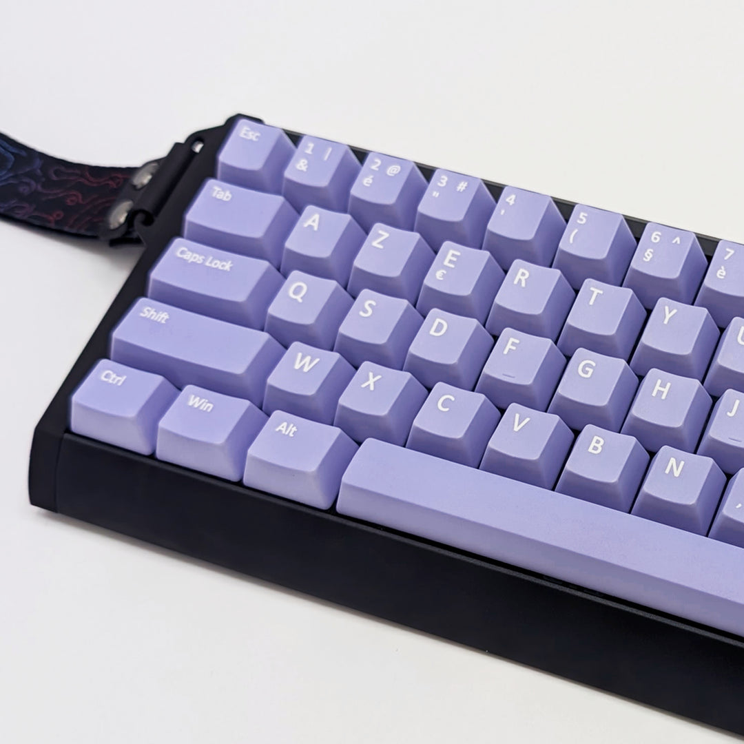 Close-up of Light Purple AZERTY PBT keycaps with white legends, non-backlit OEM profile keys with a matte finish on a mechanical keyboard.