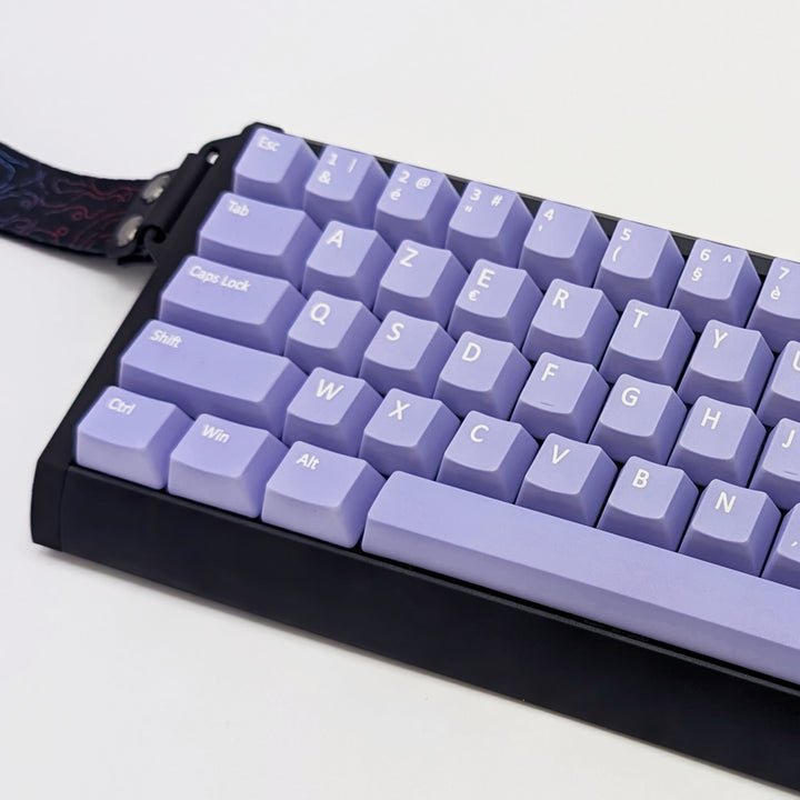 Close-up of Light Purple AZERTY PBT keycaps with white legends, non-backlit OEM profile keys with a matte finish on a mechanical keyboard.