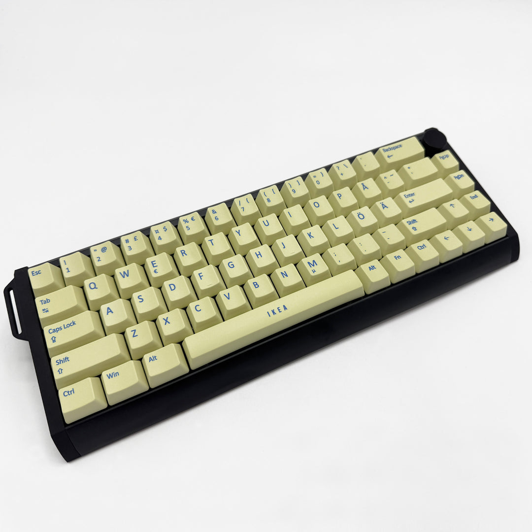 Light Yellow OEM profile QWERTY PBT keycaps on a mechanical keyboard, showing non-backlit keys with dye-sublimated blue legends.