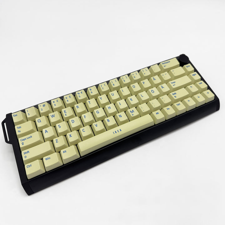 Light Yellow OEM profile QWERTY PBT keycaps on a mechanical keyboard, showing non-backlit keys with dye-sublimated blue legends.