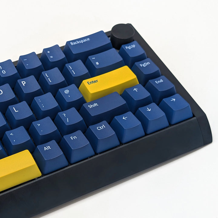 Mechanical keyboard fitted with customisable Navy QWERTY PBT keycaps, non-backlit ANSI OEM profile with white legends and matte finish.