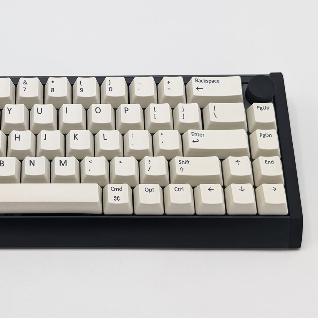 Close-up of Off White QWERTY PBT keycaps on a mechanical keyboard, featuring OEM profile keys with White, Cream, Beige and Off White Keycaps