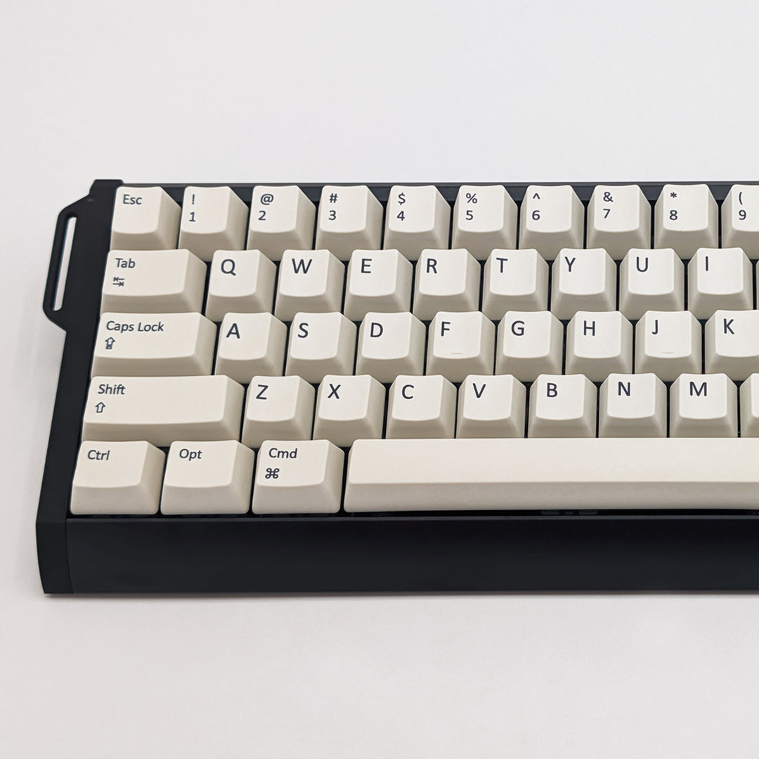 Close-up of Off White QWERTY PBT keycaps on a mechanical keyboard, featuring OEM profile keys with White, Cream, Beige and Off White Keycaps
