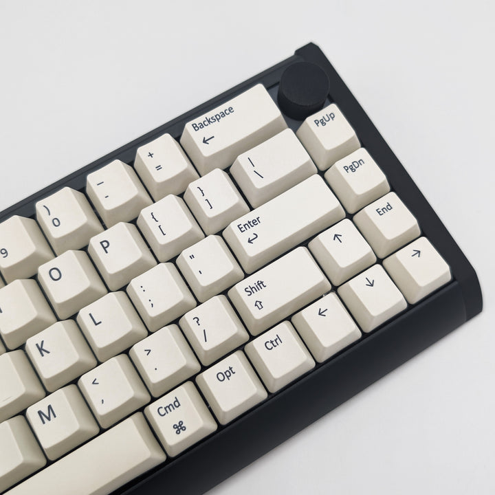 Side shot of Off White QWERTY PBT keycaps on a mechanical keyboard, featuring OEM profile keys with White, Cream, Beige and Off White Keycaps