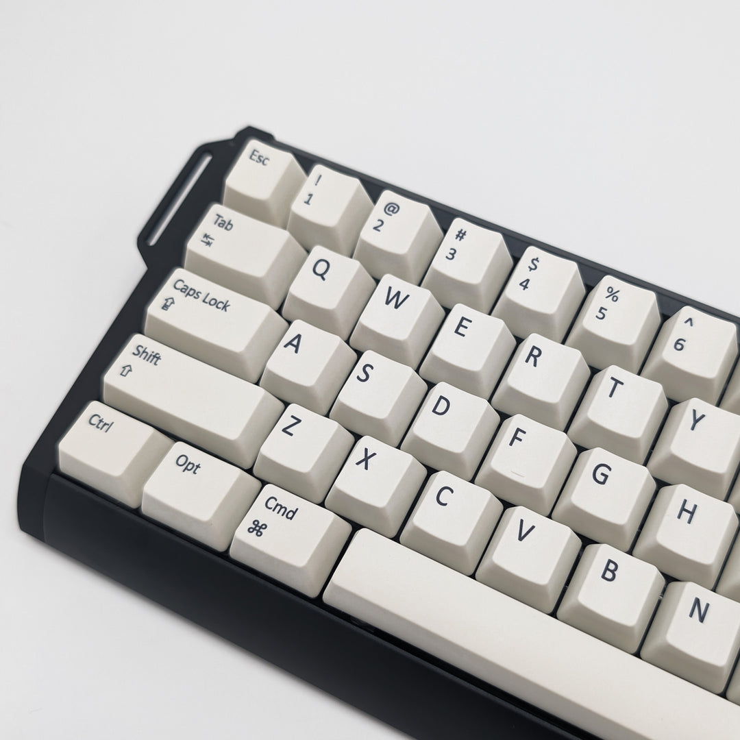 Side shot of Off White QWERTY PBT keycaps on a mechanical keyboard, featuring OEM profile keys with White, Cream, Beige and Off White Keycaps