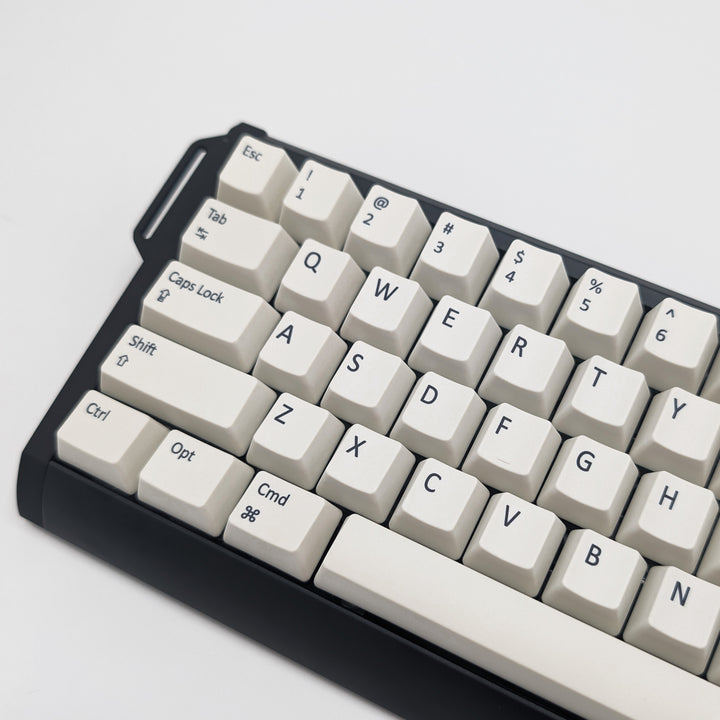 Side shot of Off White QWERTY PBT keycaps on a mechanical keyboard, featuring OEM profile keys with White, Cream, Beige and Off White Keycaps