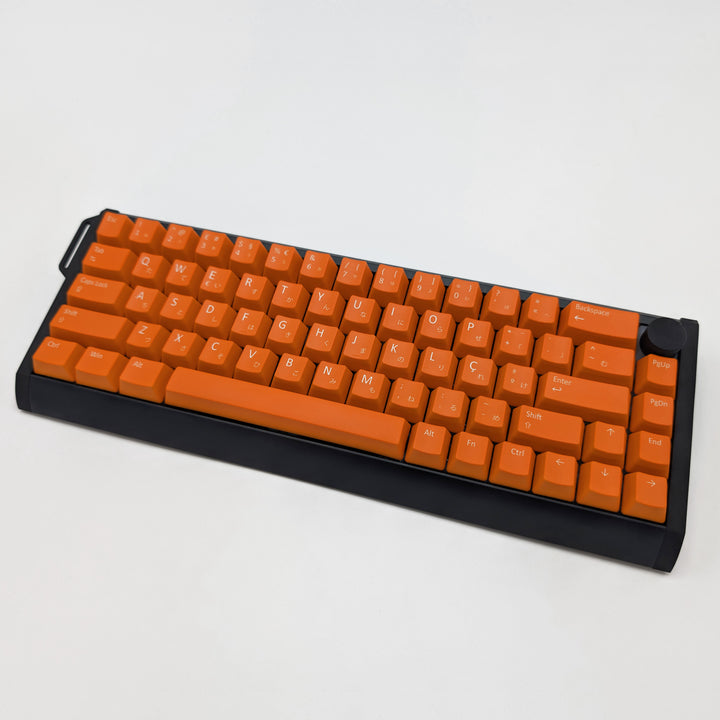 Orange ANSI OEM profile PBT keycaps with matte finish installed on a mechanical keyboard, showing non-backlit keys with dye-sublimated white legends.