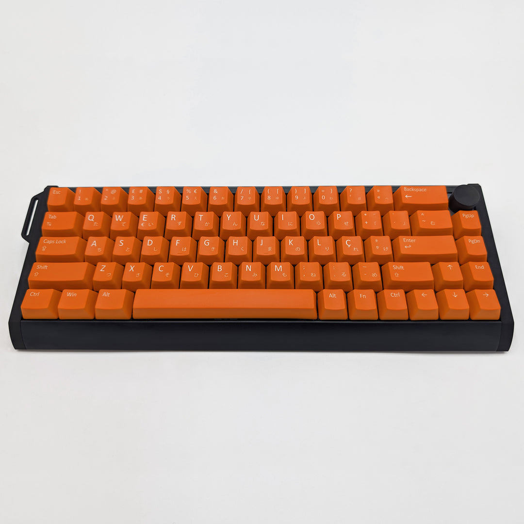 Customisable Orange non-backlit QWERTY PBT keycaps with white legends on a mechanical keyboard, featuring ANSI OEM profile keys with matte finish.