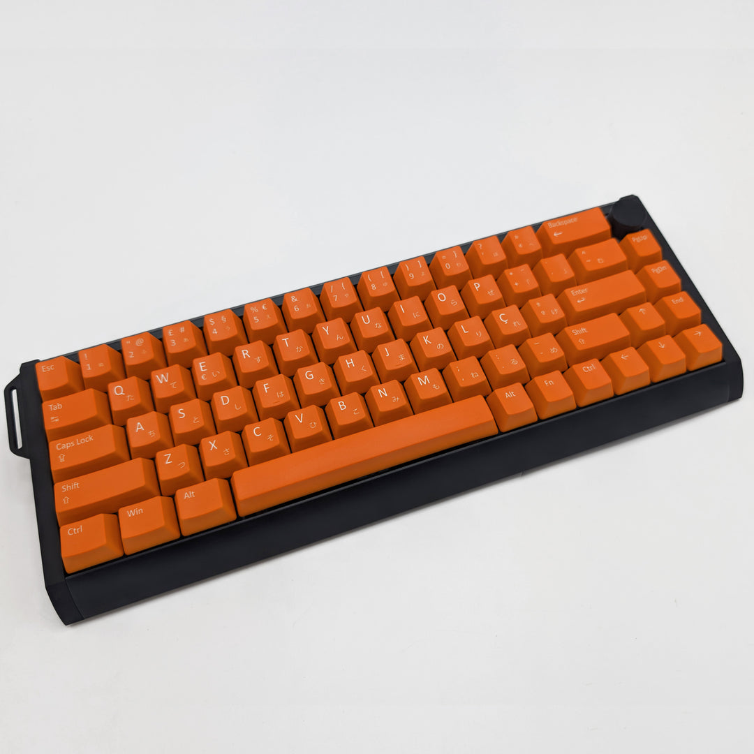 View of Orange ANSI OEM profile QWERTY PBT keycaps with matte finish on a mechanical keyboard, showing non-backlit keys with dye-sublimated white legends.
