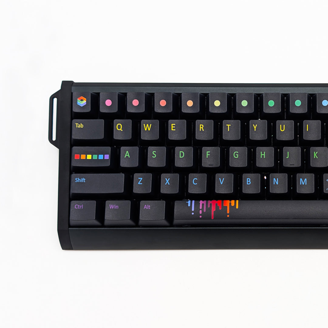 Closeup of PAINTWORKS QWERTY PBT keycaps on a mechanical keyboard, featuring OEM profile keys with Black Keycaps and Rainbow Text