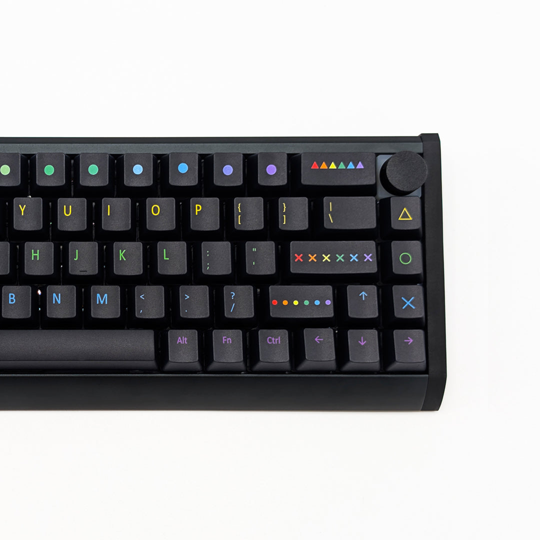 Closeup of PAINTWORKS QWERTY PBT keycaps on a mechanical keyboard, featuring OEM profile keys with Black Keycaps and Rainbow Text