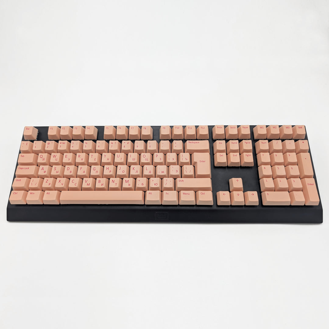 Customisable Peach non-backlit QWERTY PBT keycaps with cherry red legends on a mechanical keyboard, featuring ISO-compatible OEM profile keys with matte finish.