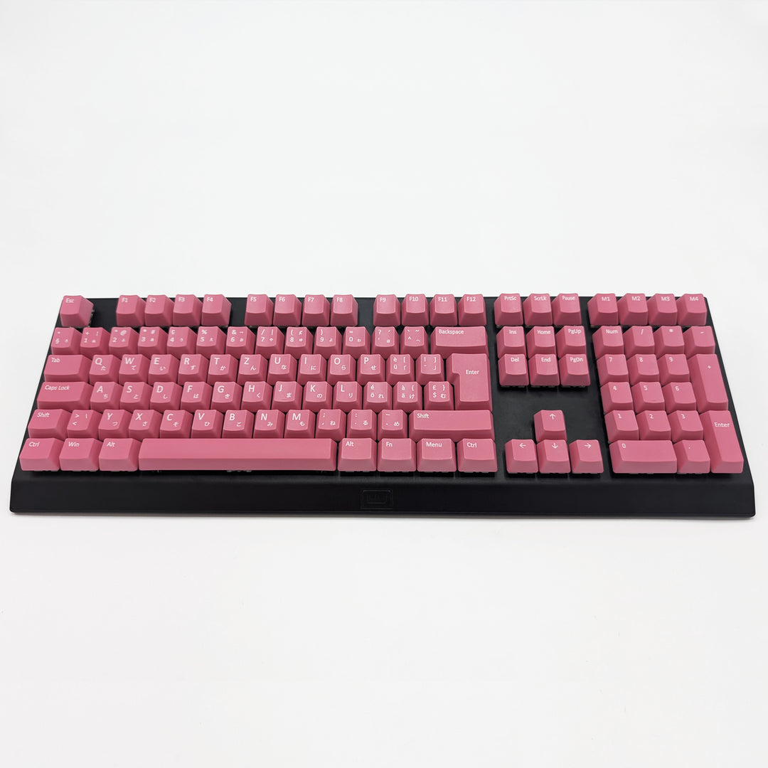 Customisable Pink non-backlit QWERTZ PBT keycaps with white legends on a mechanical keyboard, featuring ISO-compatible OEM profile keys with matte finish.