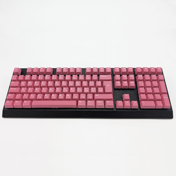 Customisable Pink non-backlit QWERTZ PBT keycaps with white legends on a mechanical keyboard, featuring ISO-compatible OEM profile keys with matte finish.