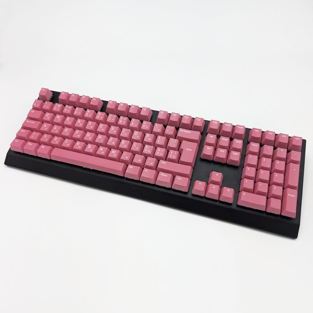 Pink ISO-compatible OEM profile QWERTZ PBT keycaps with matte finish installed on a mechanical keyboard, showing non-backlit keys with dye-sublimated white legends.