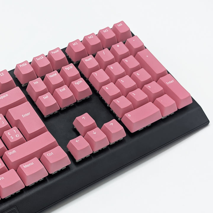 Mechanical keyboard fitted with customisable Pink QWERTZ PBT keycaps, non-backlit ISO-compatible OEM profile with white legends and matte finish.