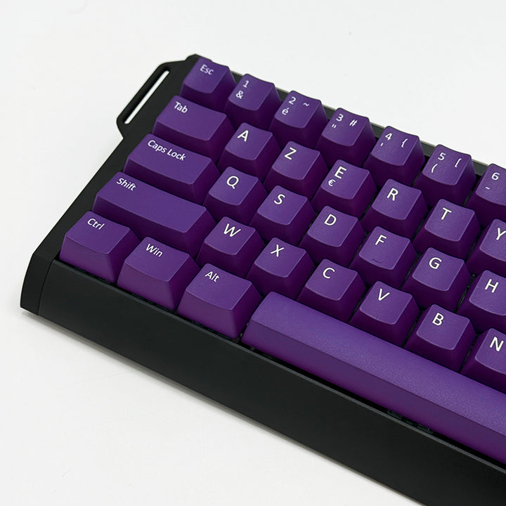 Mechanical keyboard fitted with customisable purple PBT keycaps, non-backlit ANSI AZERTY OEM profile with white legends and matte finish.