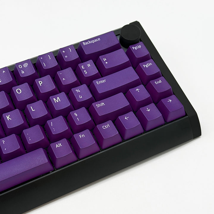 View of Purple ANSI AZERTY OEM profile PBT keycaps with matte finish on a mechanical keyboard, showing non-backlit keys with dye-sublimated white legends.