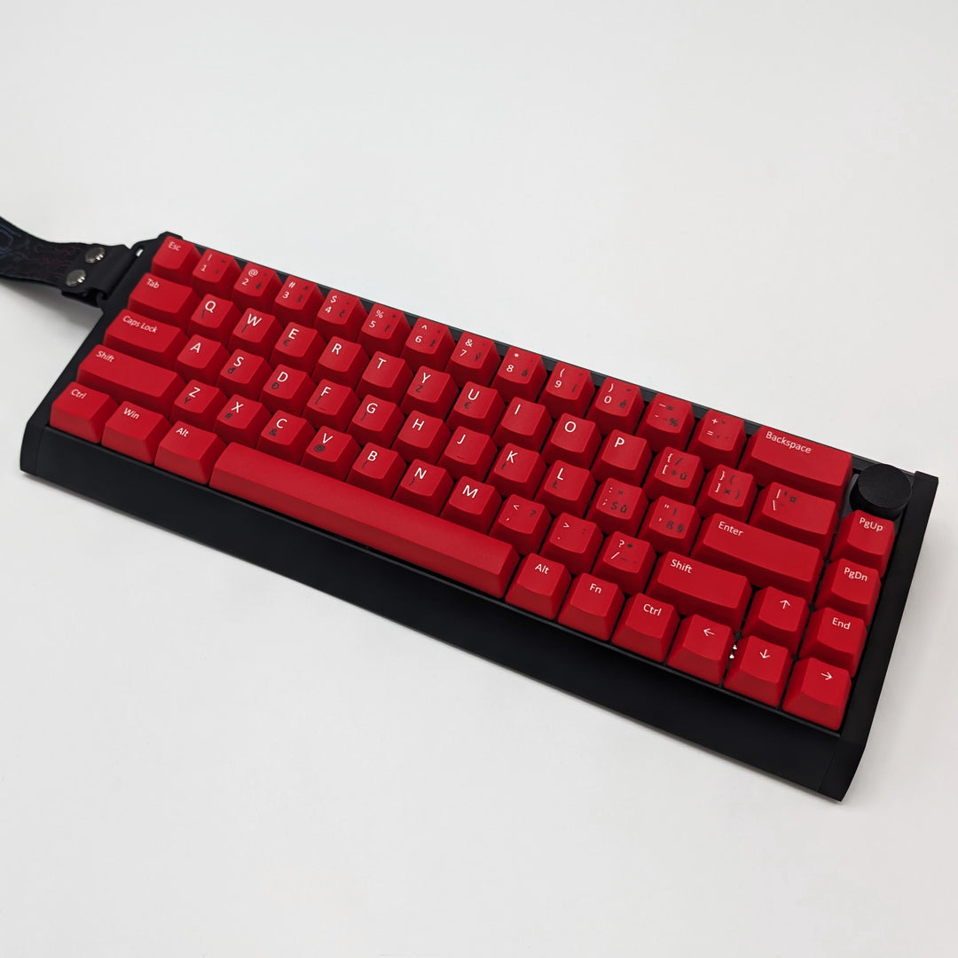 Red ANSI QWERTY OEM profile PBT keycaps with matte finish installed on a mechanical keyboard, showing non-backlit keys with dye-sublimated white and black legends.