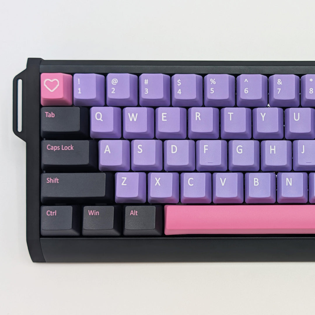 Close-up of RETRO QWERTY PBT keycaps on a mechanical keyboard, featuring OEM profile keys with Purple, Grey and Pink Keycaps