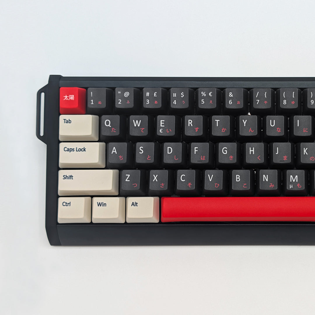 Close up of QWERTY PBT keycaps on a mechanical keyboard, featuring OEM profile keys with Grey, Off White and Red Keycaps