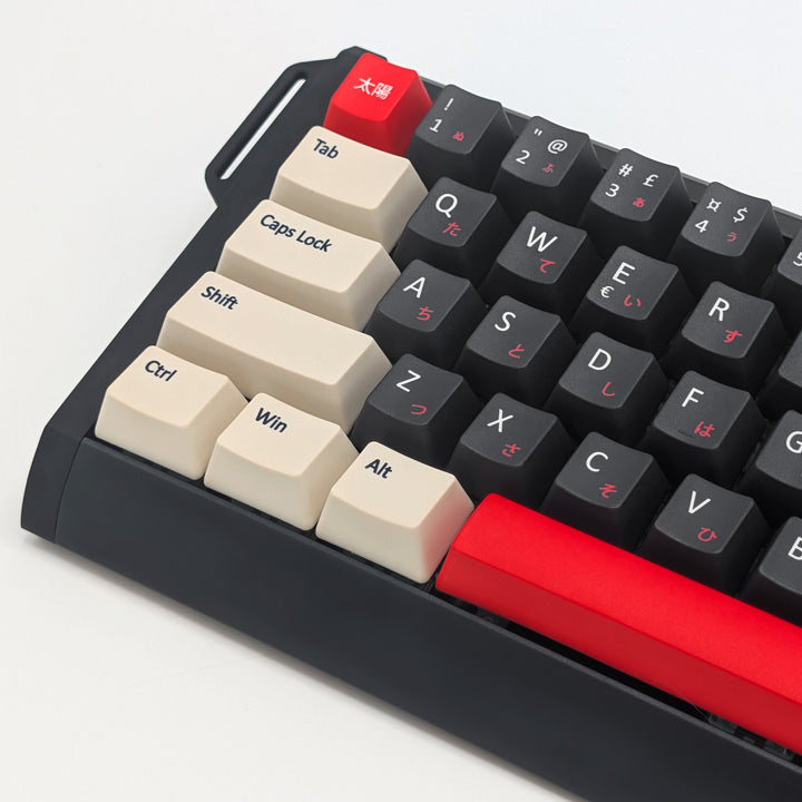 Side shot of QWERTY PBT keycaps on a mechanical keyboard, featuring OEM profile keys with Grey, Off White and Red Keycaps