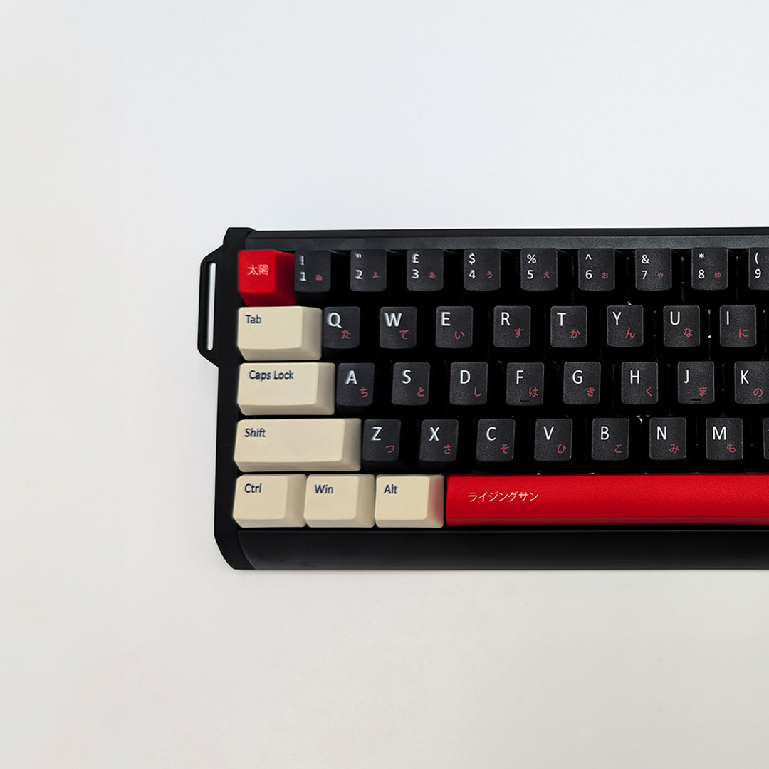 RISING SUN QWERTY PBT keycaps on a mechanical keyboard, featuring OEM profile keys with Off-White/Beige, Black and Red Keycaps